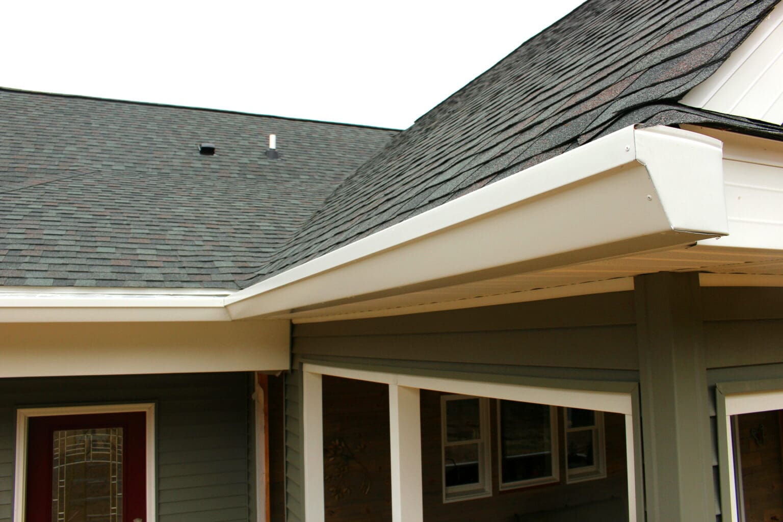 Gutter helmet installed on gutters. Up close image of the installation on a house in SE Michigan.