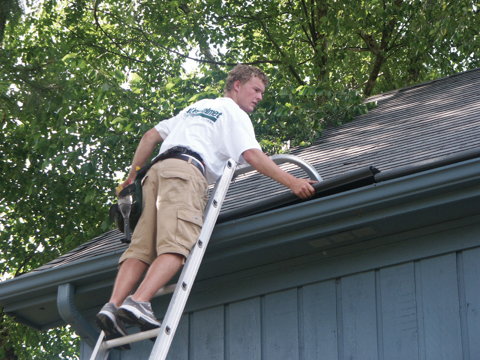 An installation worker inspects a new installation.