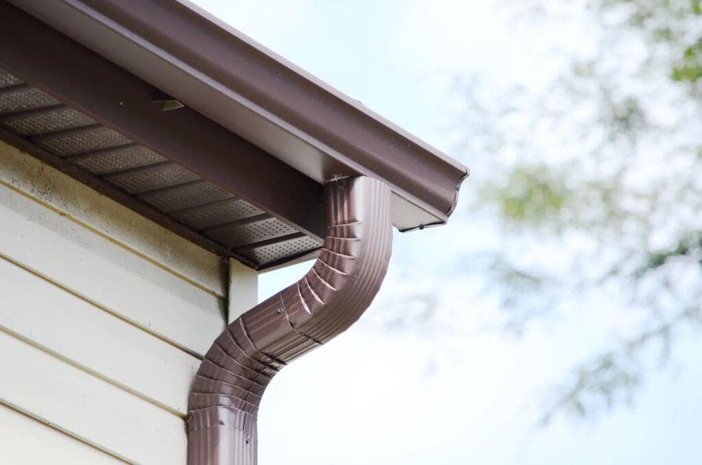 Brown gutter downspouts