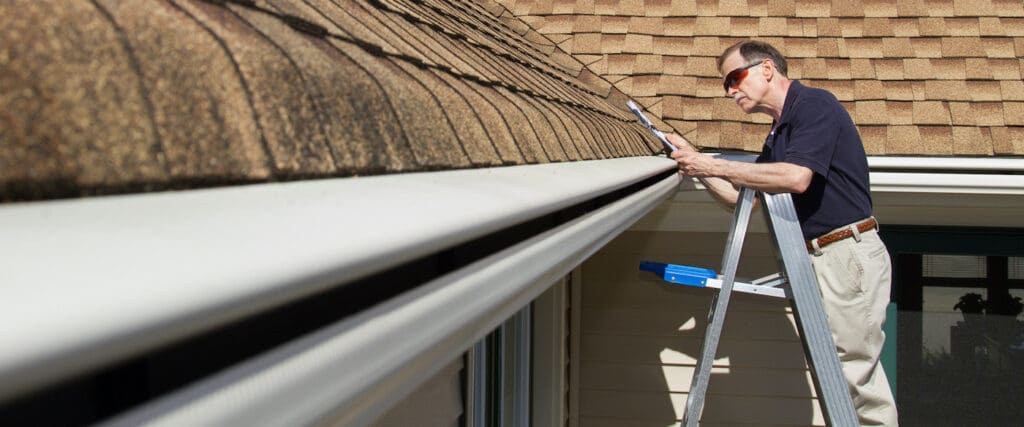 Seamless gutter and Gutter Helmet installation on a home in Southeast MIchigan