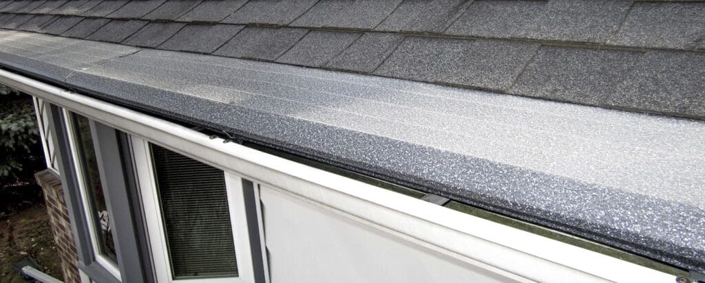 Onyx colored Gutter Helmet gutter guards installed on a home in West Bloomfield, MI.