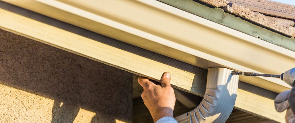 aluminum gutters being installed.
