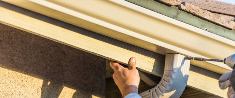 aluminum gutters being installed.